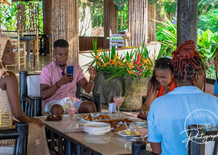 Tourists enjoying a meal at the Auberge du Parc in Dondon